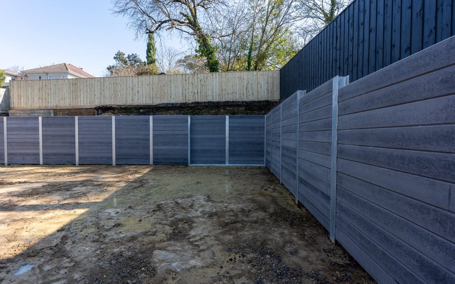 Wall height against the boundary, reaching about 2.6 metres